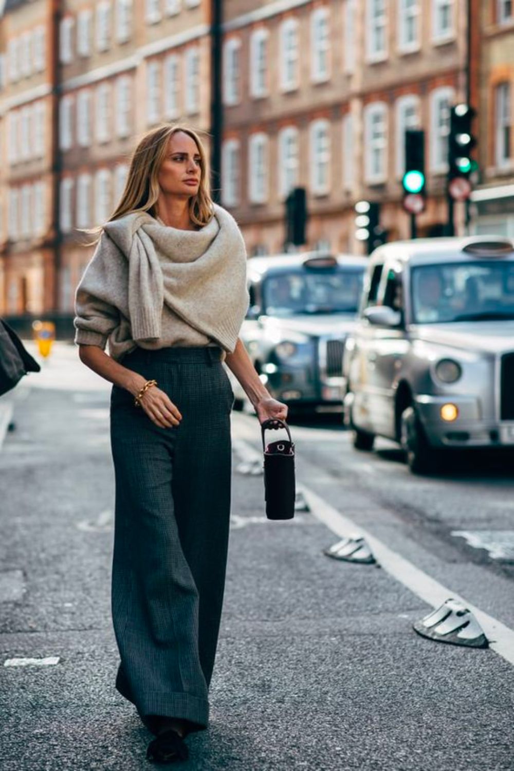 Lauren Santo Domingo wearing tailored pants and draped knitwear