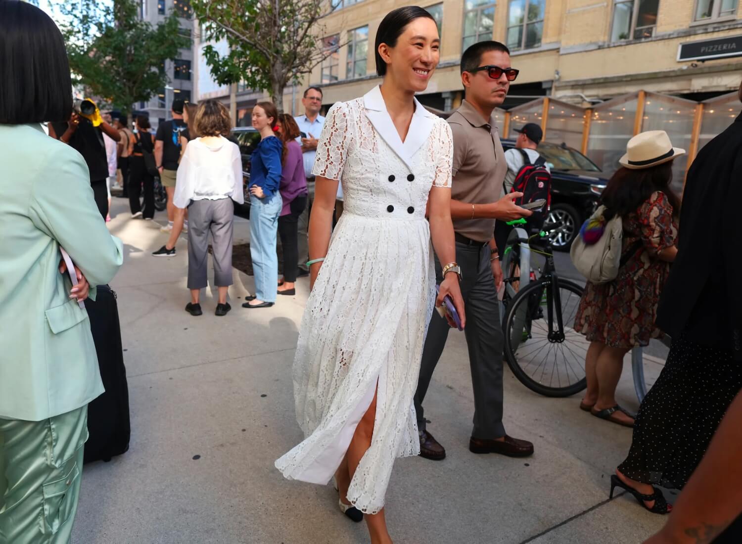 Evan Chen wearing white lace midi dress at New York Fashion Week
