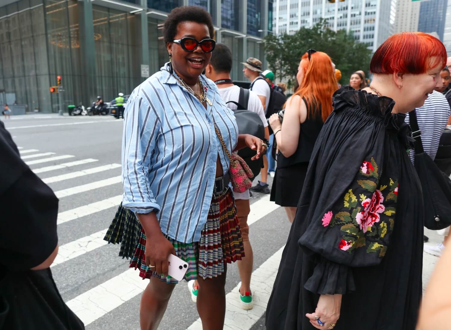 GABRIELLA KAREFA JOHNSON wearing a striped cotton shirt and mini kilt